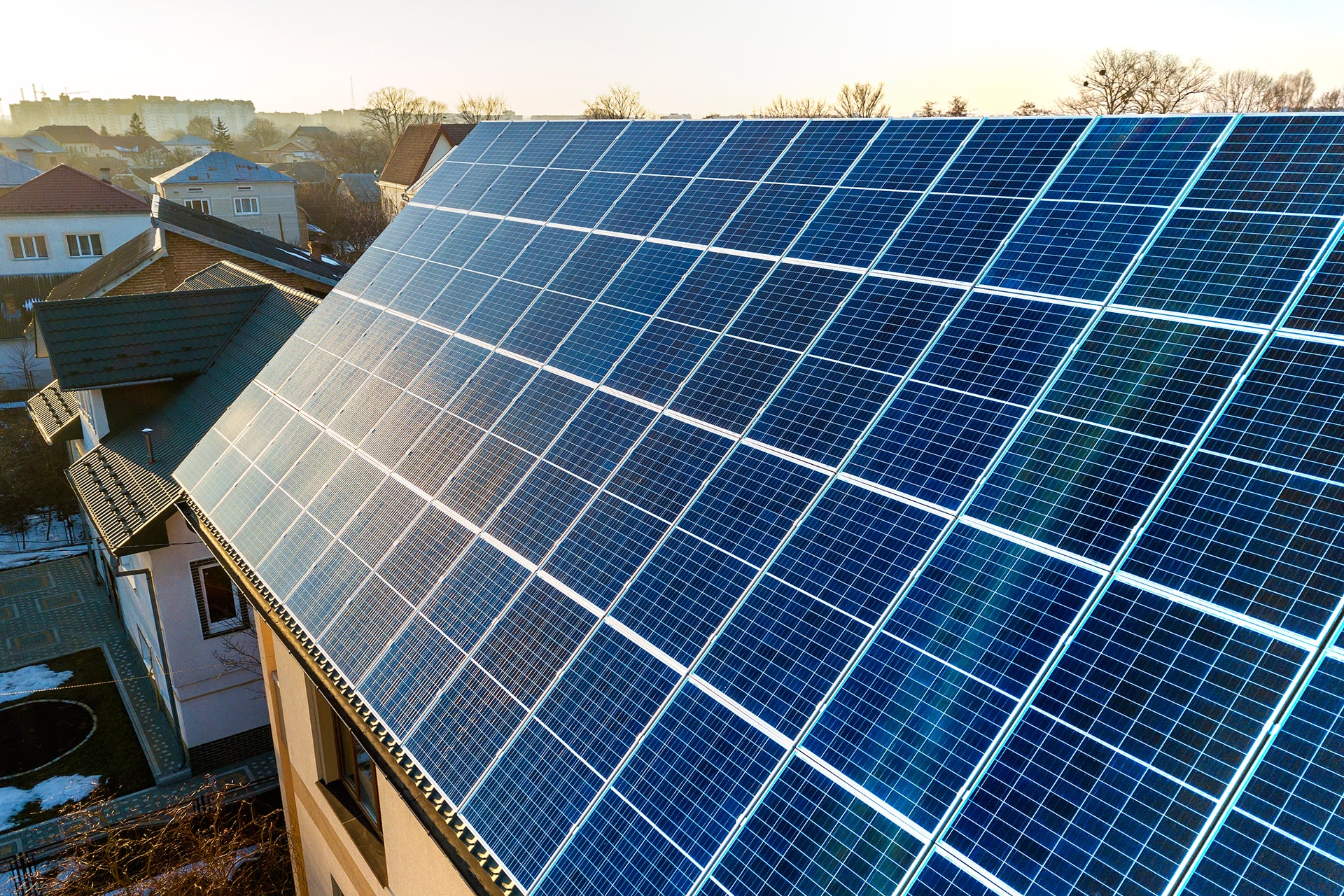 aerial-view-new-modern-two-story-house-cottage-with-blue-shiny-solar-photo-voltaic-panels-system-roof-renewable-ecological-green-energy-production-concept aerial-view-new-modern-two-story-house-cottage-with-blue-shiny-solar-photo-voltaic-panels-system-roof-renewable-ecological-green-energy-production-concept